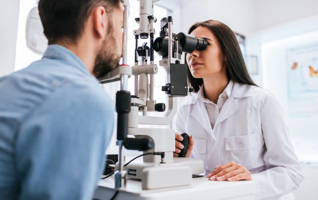a woman getting a comprehensive eye exam