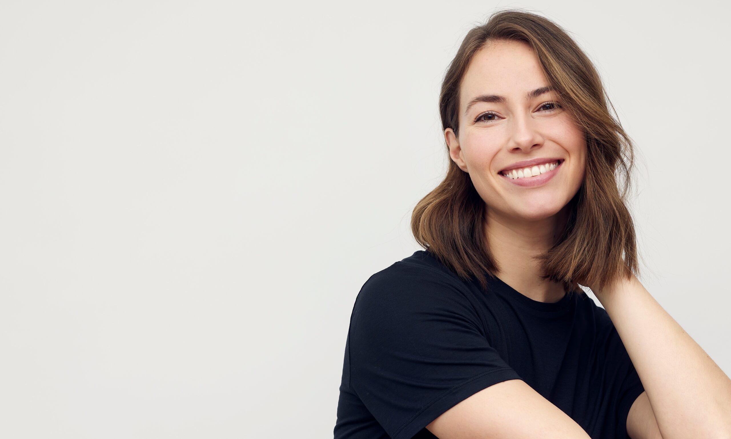 Portrait of a young happy woman smiling