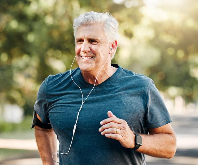 Older man jogging outside