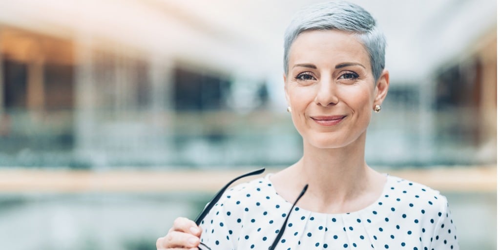 businesswoman holding eyeglasses picture 