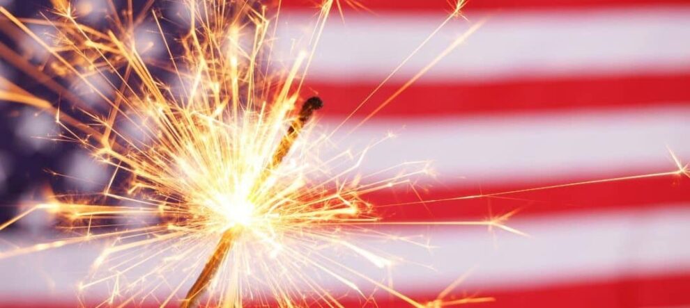 Sparkler in front of an American Flag