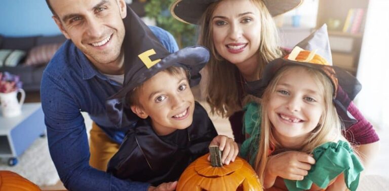 Happy family in Halloween costumes