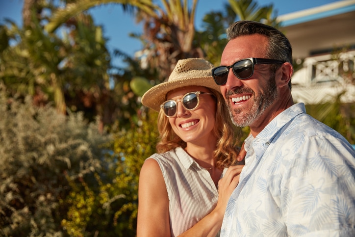 Happy couple outside wearing sunglasses