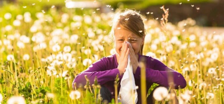 Girl suffering from spring allergies hurting her eyes